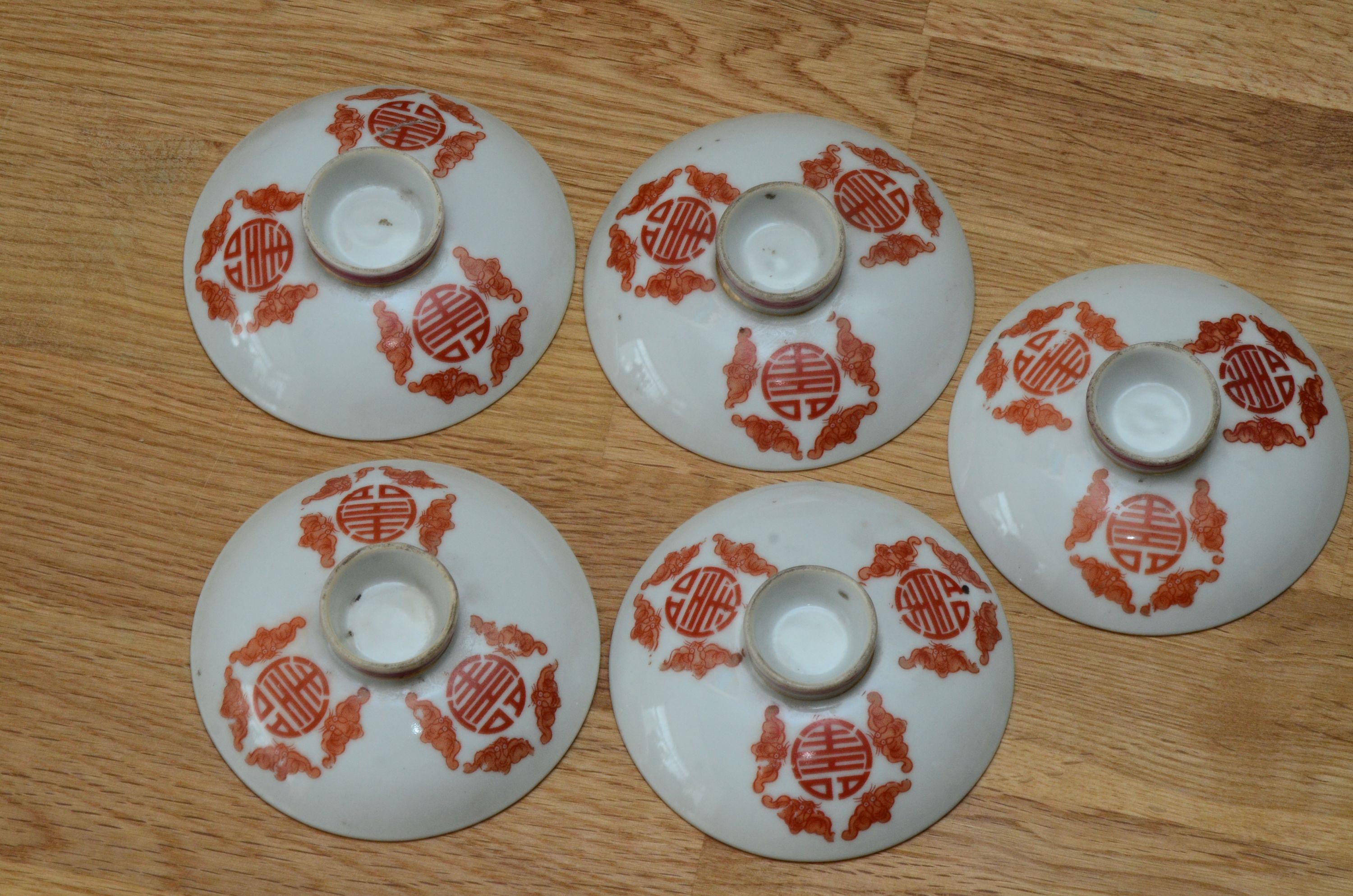 A set of five Chinese teabowls, covers and stands and a similar 'dragon' vase, 23cm